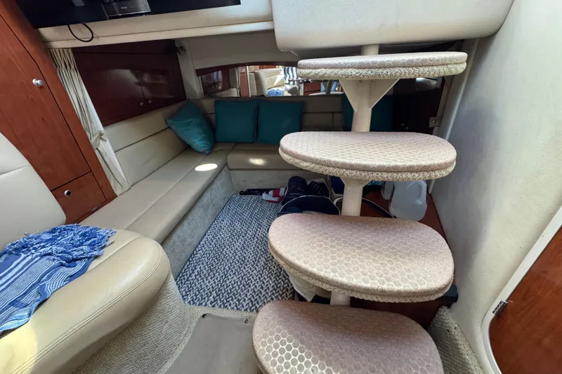 Slide: The Image of Interior of 2007 Sea Ray 340 Sundancer with cozy seating and carpeted stairs. - 27