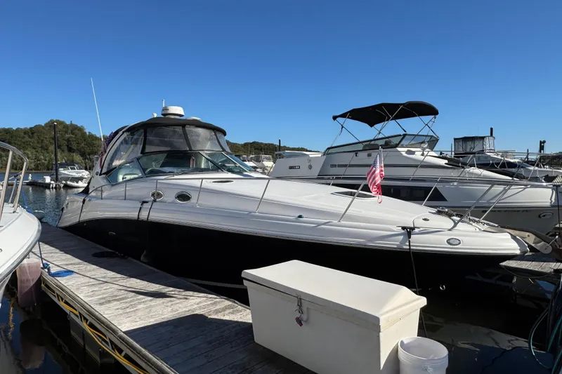 Slide: The Image of 2007 Sea Ray 340 Sundancer docked at marina under clear blue sky. - 3