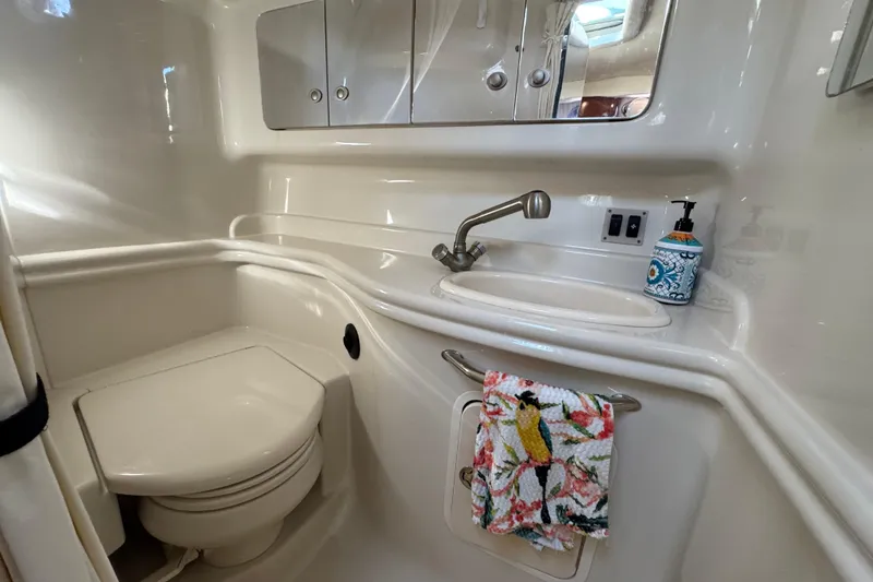 Slide: The Image of 2007 Sea Ray 340 Sundancer bathroom with sink, mirror, and toilet. - 30