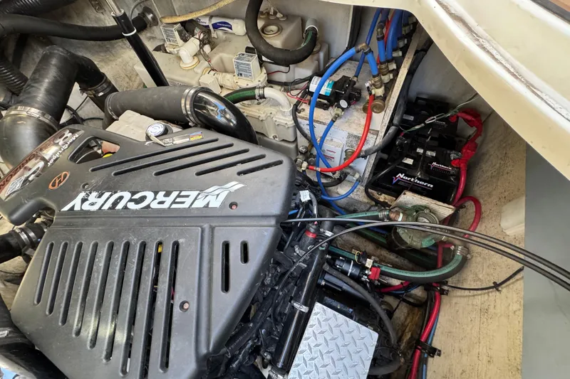 Slide: The Image of Engine compartment of a 2007 Sea Ray 340 Sundancer with Mercury components and wiring. - 36