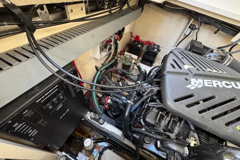 Slide: The Image of Engine compartment of a 2007 Sea Ray 340 Sundancer with Mercury components and wiring. - 37