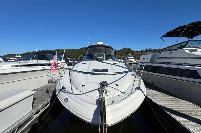 Slide: The Image of 2007 Sea Ray 340 Sundancer docked at marina under clear blue sky. - 4