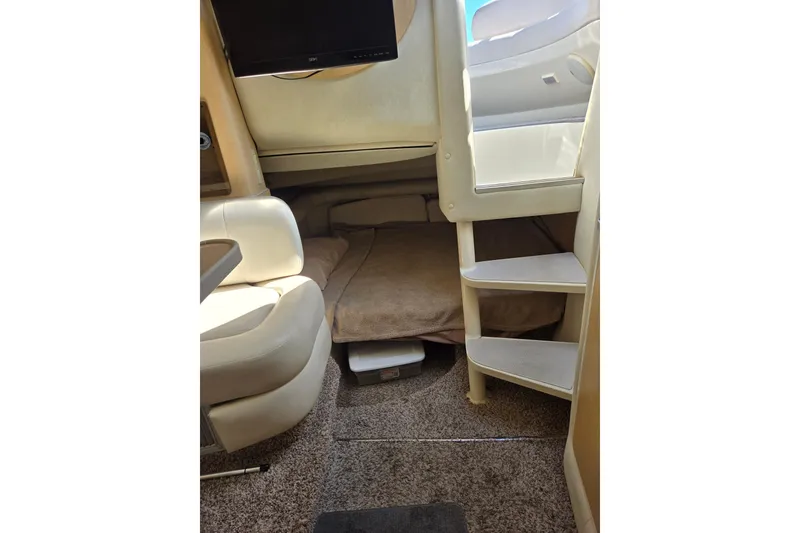 Slide: The Image of Interior of a 1998 Regal Commodore 3060 boat with seating and steps. - 10