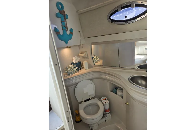 Slide: The Image of Bathroom interior of 1998 Regal Commodore 3060 boat with nautical decor. - 12