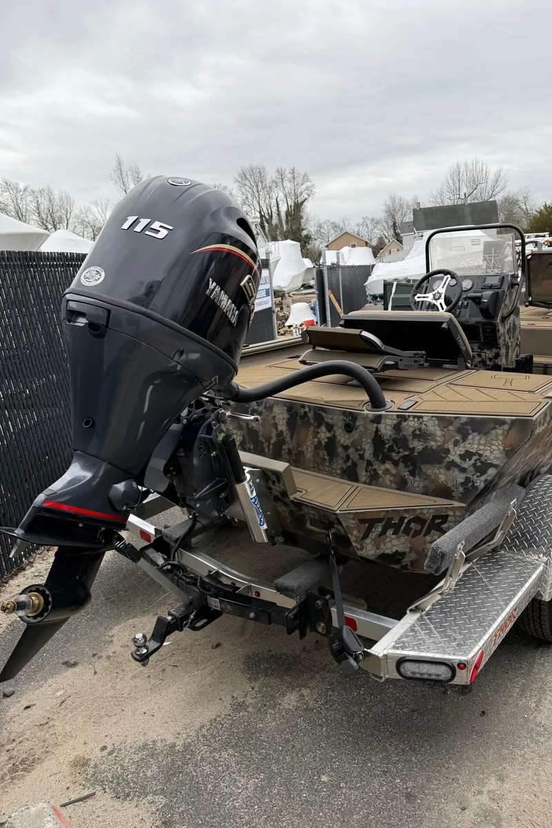 Slide: The Image of Thor 1900 boat with 115 horsepower engine, 2025 model, on a trailer. - 6