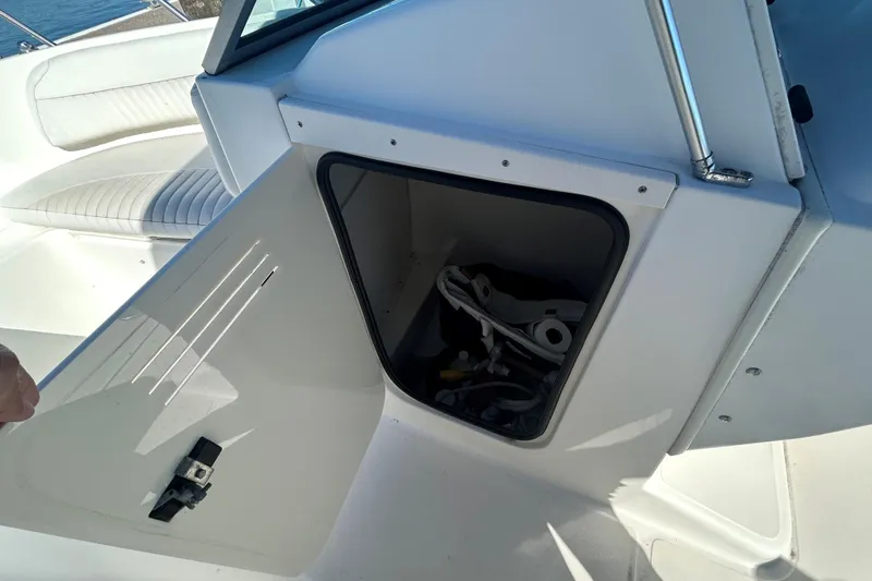 Slide: The Image of Open storage compartment on a 2006 Boston Whaler 210 Ventura boat. - 19