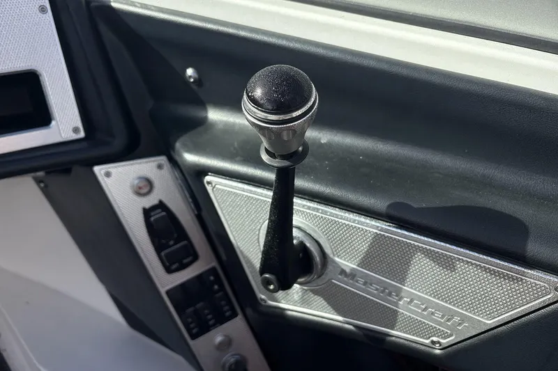 Slide: The Image of 2012 MasterCraft X-15 boat throttle control and dashboard detail. - 8