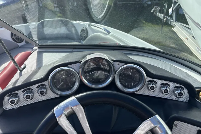 Slide: The Image of Dashboard of a 2012 MasterCraft X-15 boat with gauges and controls. - 9