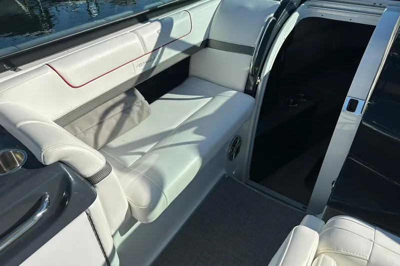 Slide: The Image of 2018 Formula 290 Sun Sport boat interior with white seating and cup holders. - 11