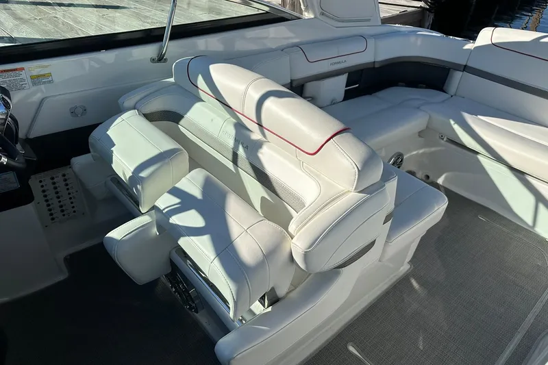Slide: The Image of 2018 Formula 290 Sun Sport boat interior with white leather seating and modern design. - 15