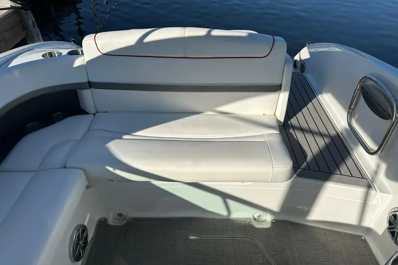 Slide: The Image of 2018 Formula 290 Sun Sport boat interior with white seating and cup holders. - 17