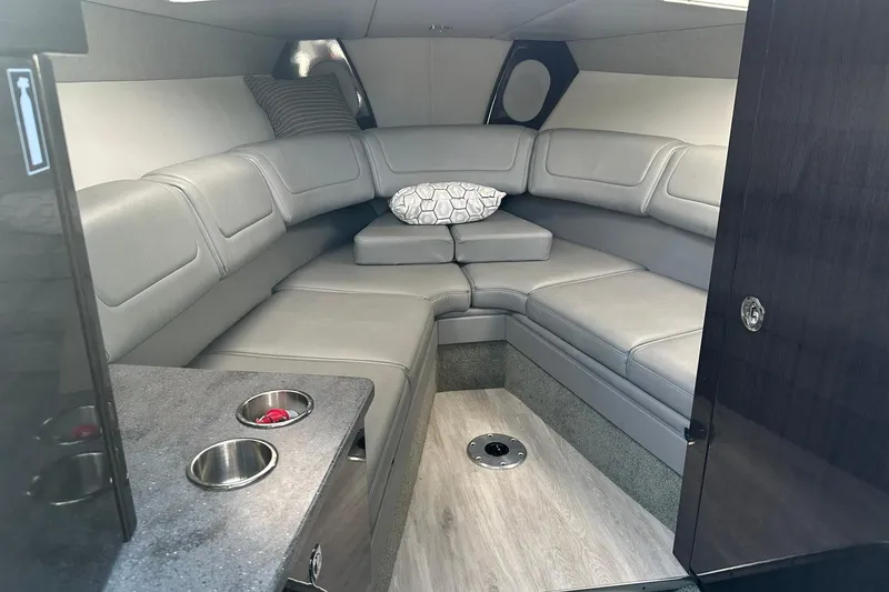 Slide: The Image of 2018 Formula 290 Sun Sport cabin interior with gray seating and modern design. - 18