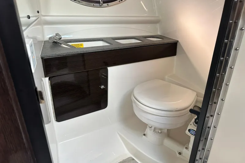 Slide: The Image of 2018 Formula 290 Sun Sport boat bathroom with toilet and sink. - 21