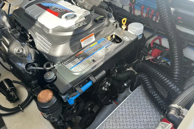 Slide: The Image of Engine compartment of a 2018 Formula 290 Sun Sport boat, featuring a Mercury 300 engine. - 24