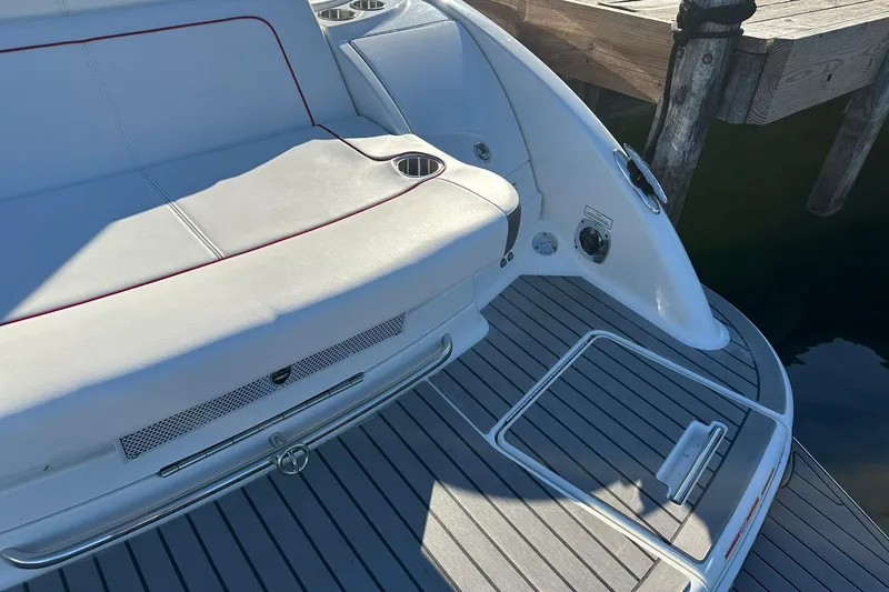 Slide: The Image of 2018 Formula 290 Sun Sport boat deck with seating and cup holders. - 6