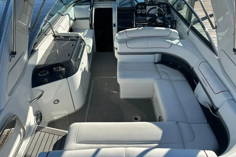 Slide: The Image of 2018 Formula 290 Sun Sport boat interior with white seating and sleek dashboard design. - 7