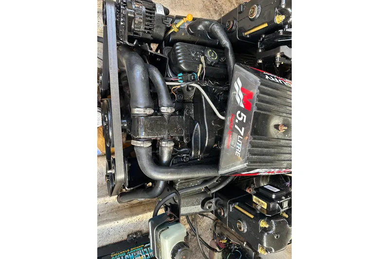 Slide: The Image of Engine of 2001 Sea Ray 240 Sundancer, featuring a 5.7-liter MerCruiser motor. - 10