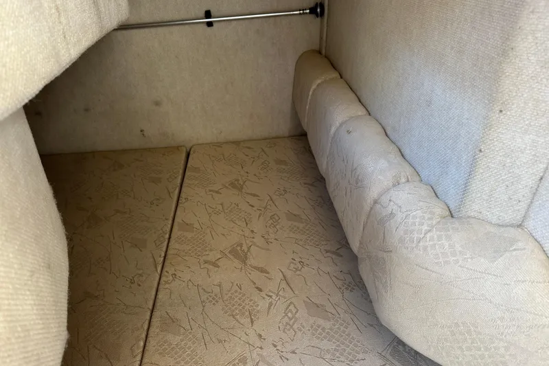 Slide: The Image of Interior cabin of 2001 Sea Ray 240 Sundancer with beige upholstery. - 14