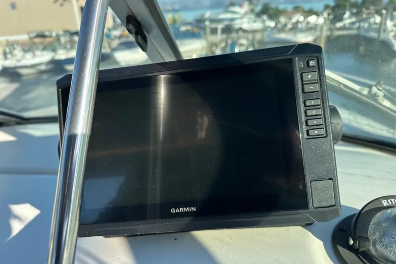 Slide: The Image of Garmin navigation system on 2001 Sea Ray 240 Sundancer boat dashboard. - 7