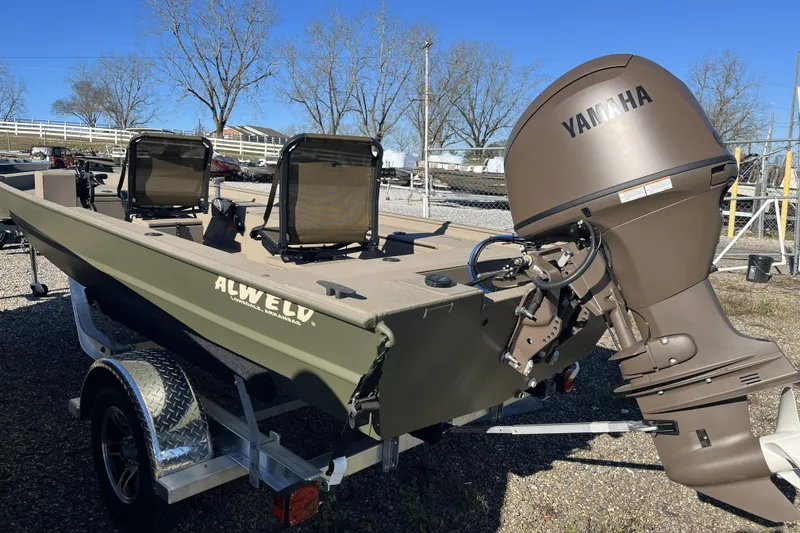 Slide: The Image of 2025 Alweld 1752PF boat with Yamaha outboard motor on a trailer. - 10
