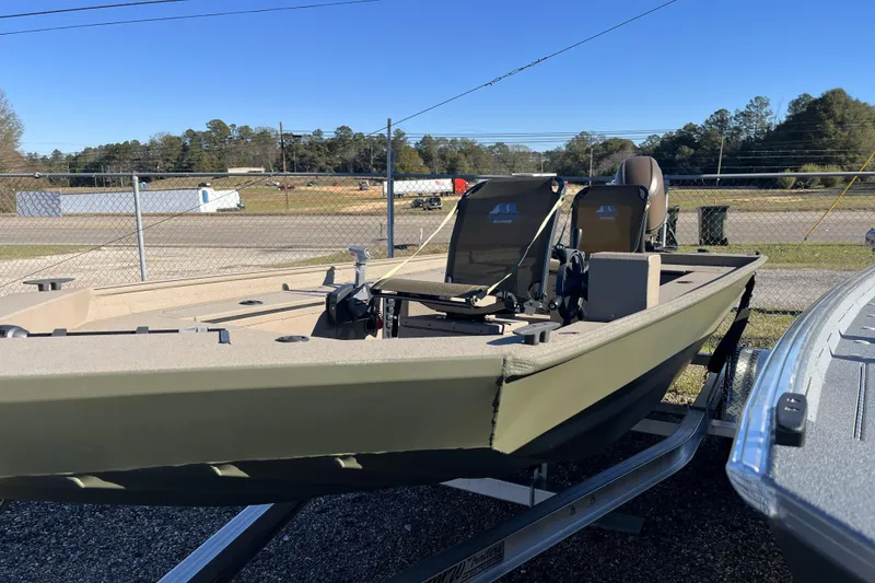 Slide: The Image of 2025 Alweld 1752PF boat on trailer, parked outdoors under clear blue sky. - 7
