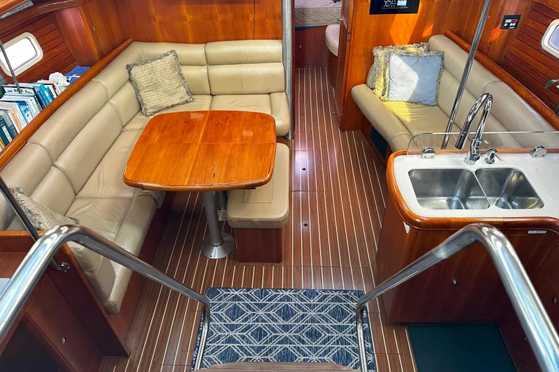 Slide: The Image of Luxurious interior of 2006 Hunter 45 CC yacht with leather seating and wooden finishes. - 13