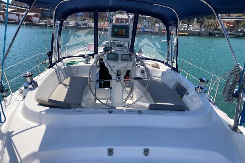 Slide: The Image of Cockpit of 2006 Hunter 45 CC sailboat with steering wheel and navigation equipment. - 2