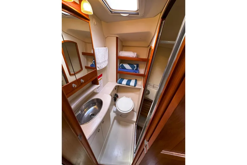 Slide: The Image of Luxurious bathroom interior of 2006 Hunter 45 CC yacht with sink and storage. - 37
