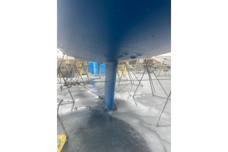 Slide: The Image of 2006 Hunter 45 CC sailboat hull in dry dock, supported by stands. - 50