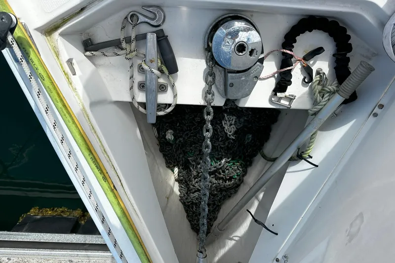 Slide: The Image of Anchor chain and winch system on a 2006 Hunter 45 CC sailboat. - 62