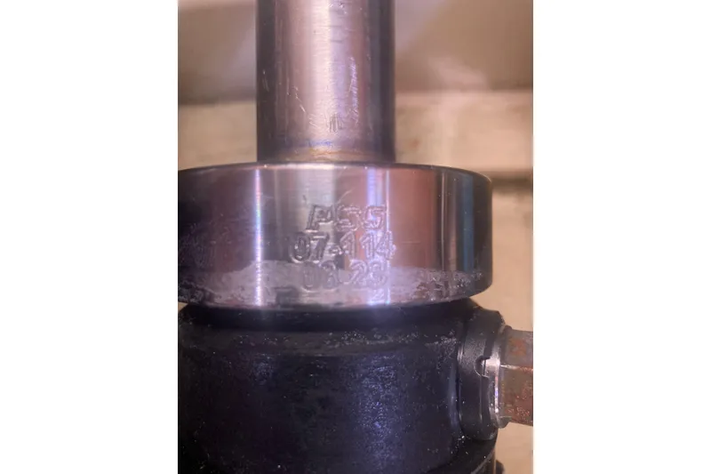 Slide: The Image of Close-up of a metal component with engraved numbers, part of a 2006 Hunter 45 CC. - 65