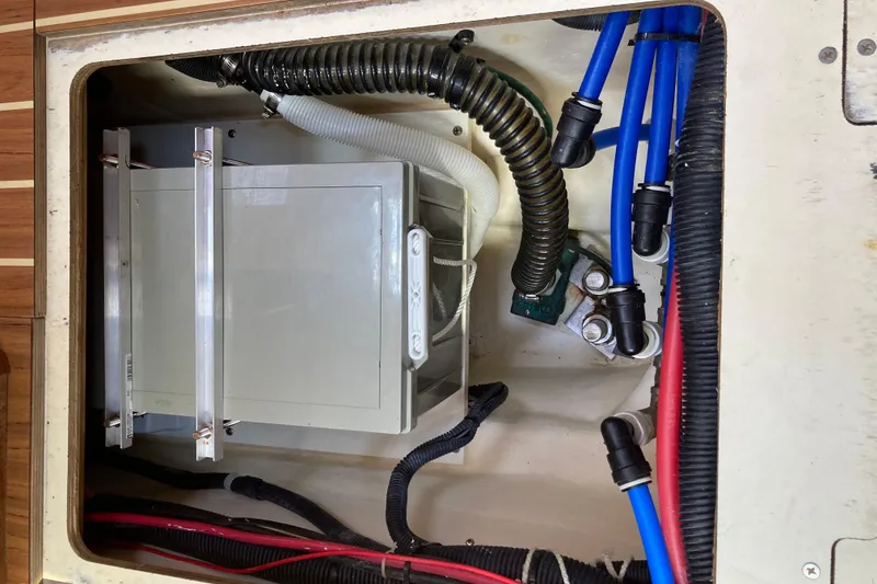 Slide: The Image of Electrical compartment of a 2006 Hunter 45 CC sailboat with wiring and components. - 66