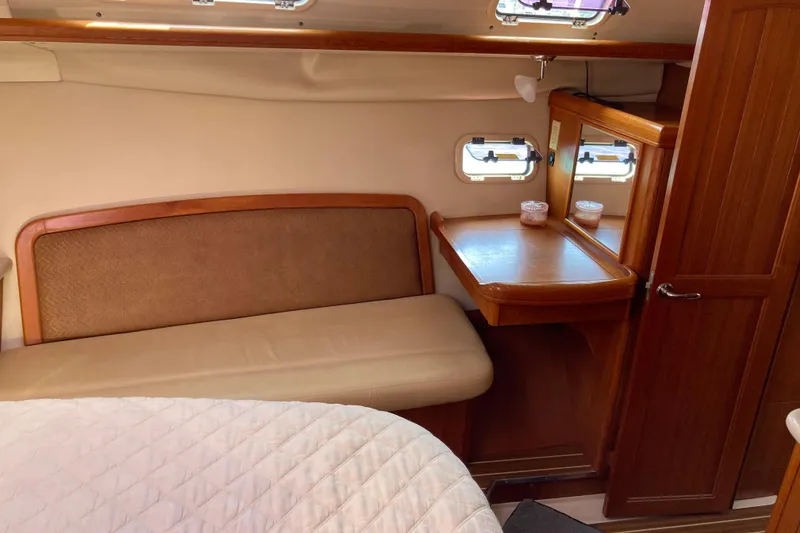 Slide: The Image of Interior of 2006 Hunter 45 CC yacht with wooden furnishings and seating area. - 8