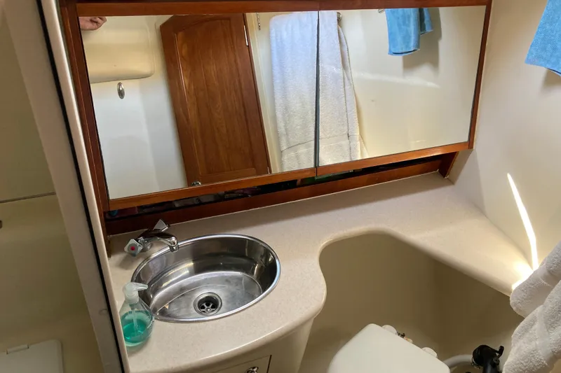Slide: The Image of Bathroom interior of 2006 Hunter 45 CC yacht with sink and mirror. - 9