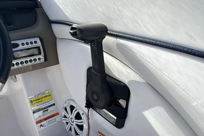 Slide: The Image of Interior of 2007 Four Winns 200 Horizon boat showing control panel and speaker. - 11