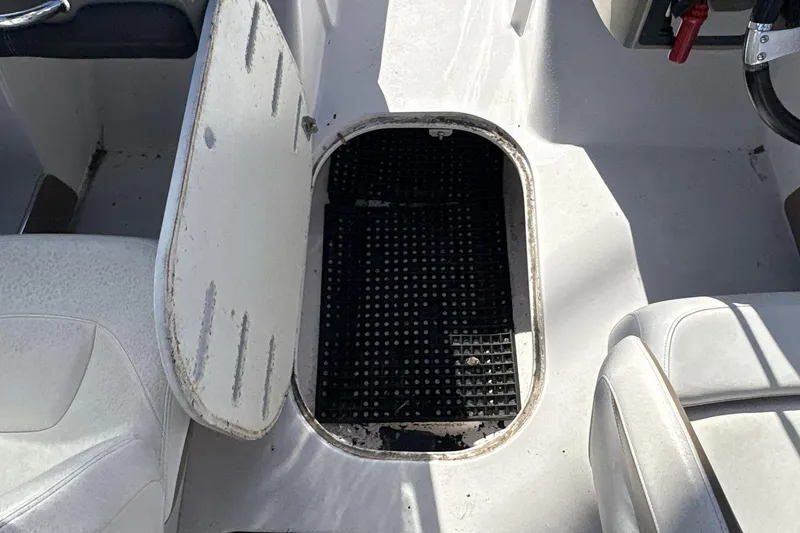 Slide: The Image of Open storage compartment on 2007 Four Winns 200 Horizon boat interior. - 13