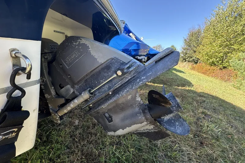 Slide: The Image of 2007 Four Winns 200 Horizon boat with Volvo Penta outdrive on grassy terrain. - 3