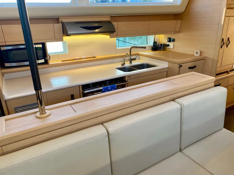 Slide: The Image of Modern kitchen interior of 2016 Jeanneau 54 yacht with sleek cabinetry and appliances. - 20