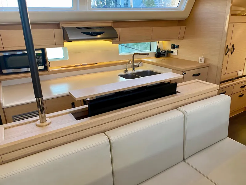 Slide: The Image of Modern kitchen interior of 2016 Jeanneau 54 yacht with sleek cabinetry and appliances. - 21