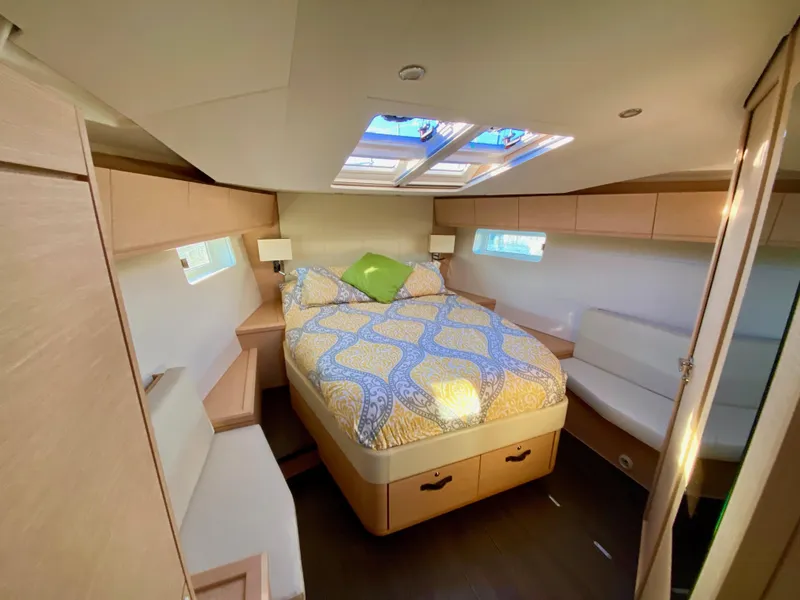 Slide: The Image of Luxurious cabin interior of 2016 Jeanneau 54 yacht with skylights and cozy bed. - 33