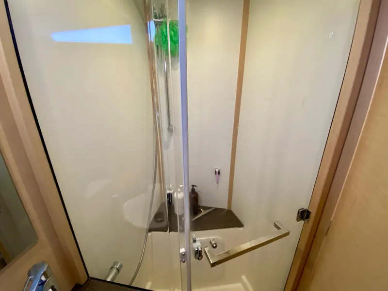 Slide: The Image of Shower area in 2016 Jeanneau 54 yacht with glass door and modern fixtures. - 40