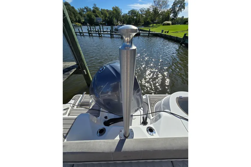 Slide: The Image of 2022 Sea Fox 249 Avenger boat docked by a scenic waterfront. - 17