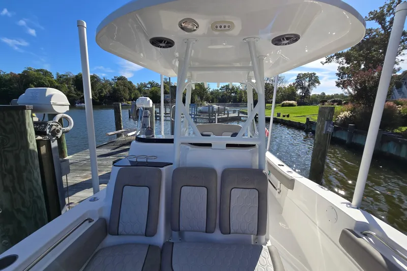 Slide: The Image of 2022 Sea Fox 249 Avenger boat docked by a scenic waterfront. - 38