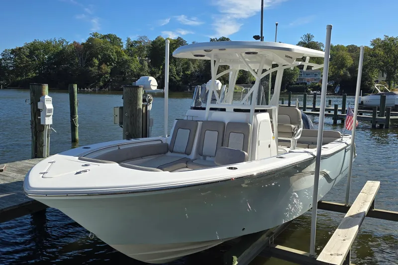 Slide: The Image of 2022 Sea Fox 249 Avenger boat docked on a sunny day by the water. - 5