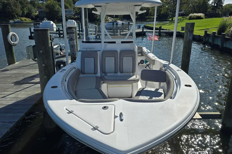 Slide: The Image of 2022 Sea Fox 249 Avenger boat docked, featuring spacious seating and sleek design. - 6
