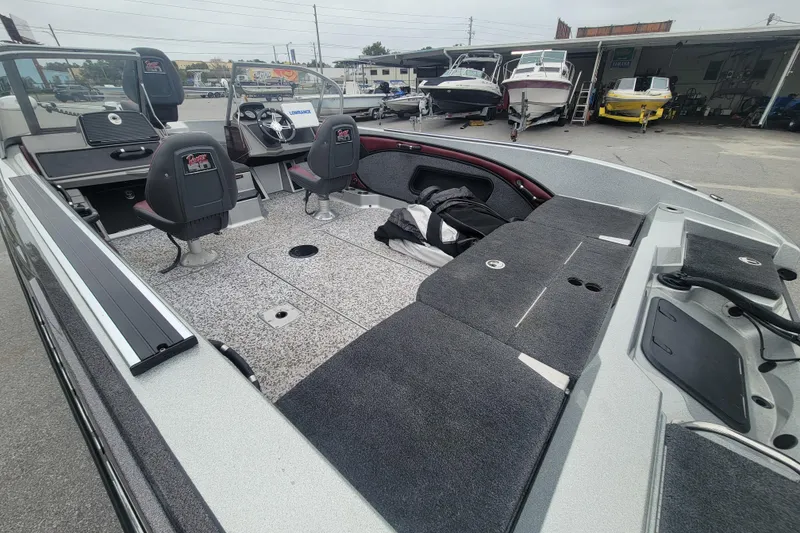 Slide: The Image of 2018 Ranger 2080MS Angler boat interior with seating and storage compartments. - 11