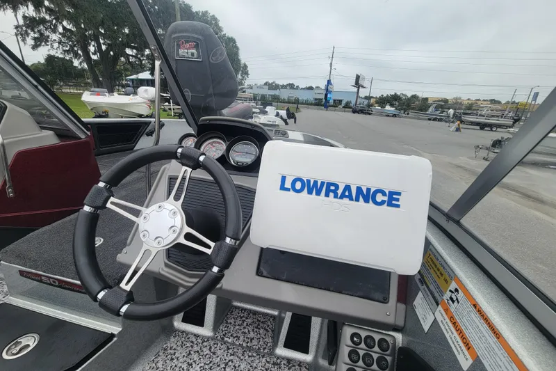 Slide: The Image of 2018 Ranger 2080MS Angler boat dashboard with Lowrance HDS system and steering wheel. - 13