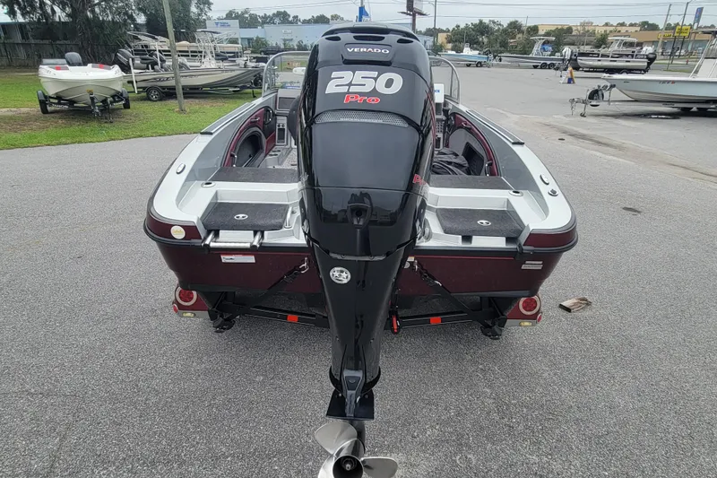 Slide: The Image of 2018 Ranger 2080MS Angler boat with 250 Pro Verado engine, parked outdoors. - 4