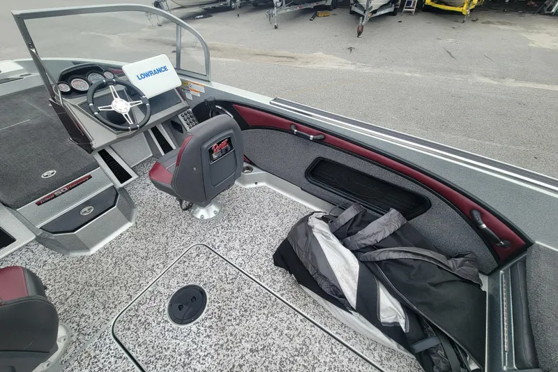 Slide: The Image of 2018 Ranger 2080MS Angler boat interior with steering wheel and seating. - 7