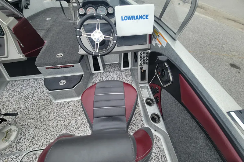 Slide: The Image of 2018 Ranger 2080MS Angler boat interior with steering wheel and Lowrance display. - 8